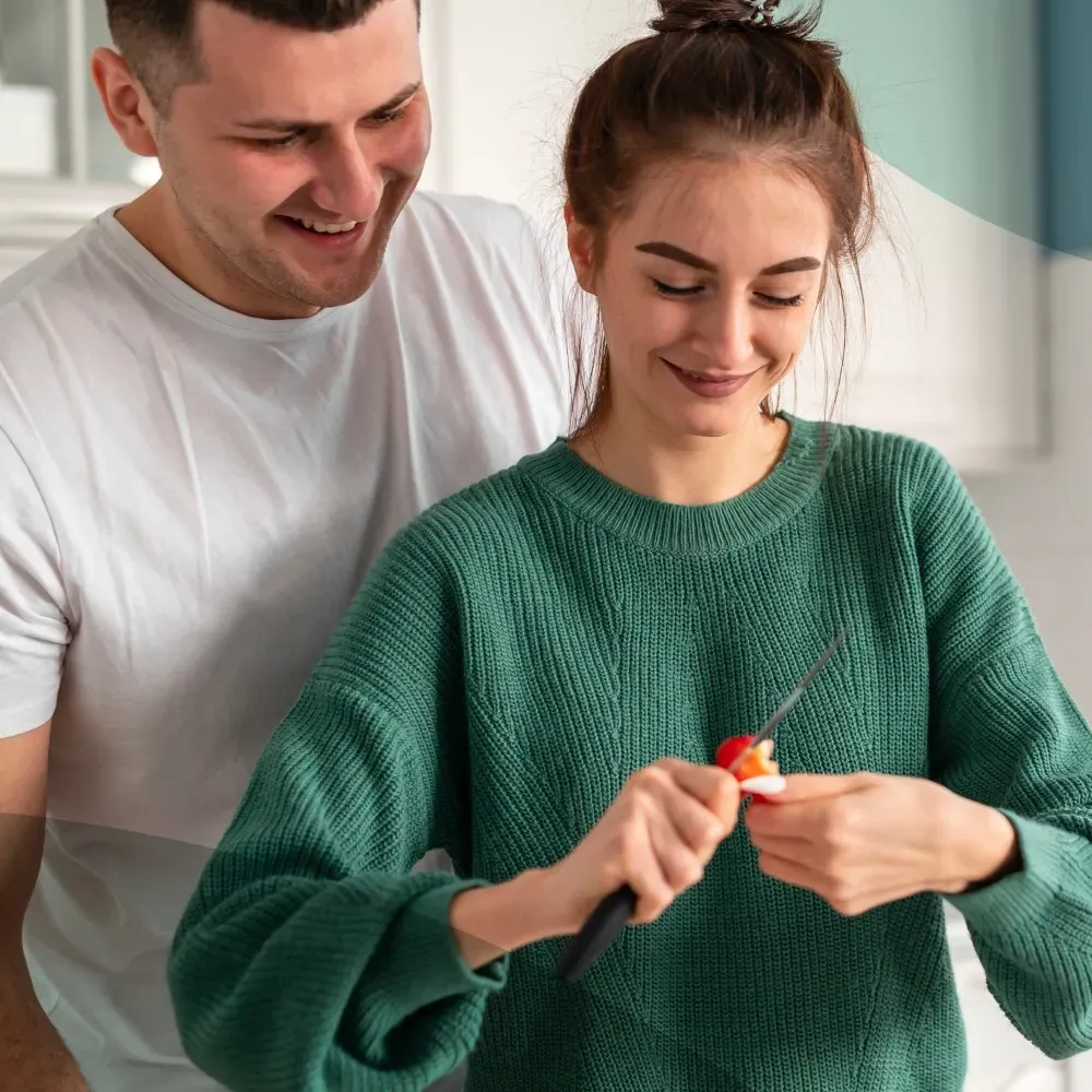 A couple at home together reviewing a discreet at-home sample-collection kit before a comprehensive sexual health checkup in Dubai with Vesta Care