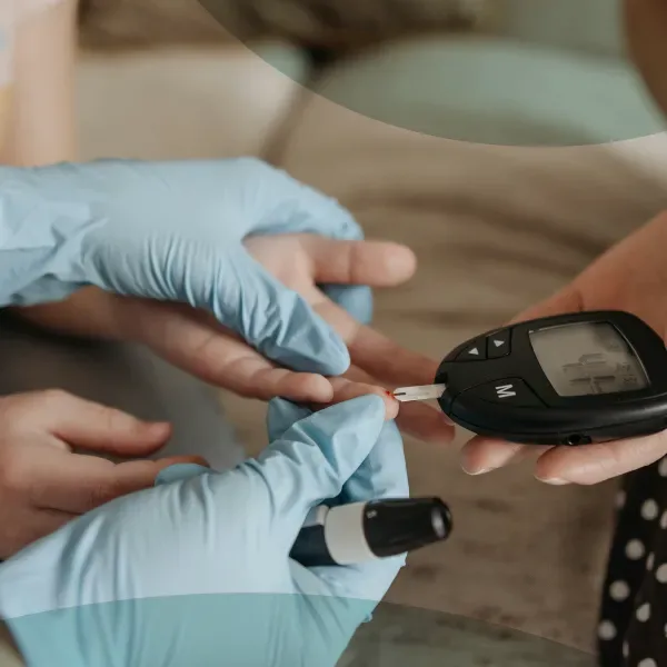DHA-licensed Vesta Care nurse providing diabetes care and blood sugar monitoring at home in Dubai