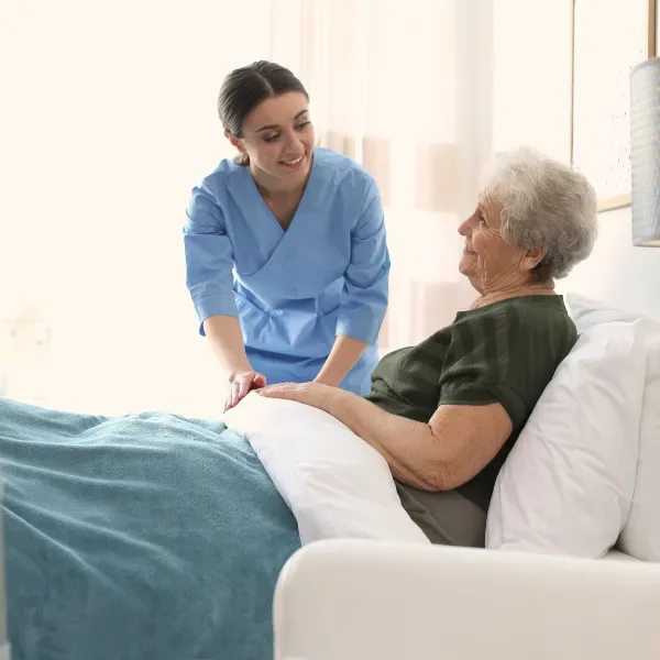 DHA-licensed physiotherapist guiding a patient through post-operative rehabilitation exercises at home in Dubai
