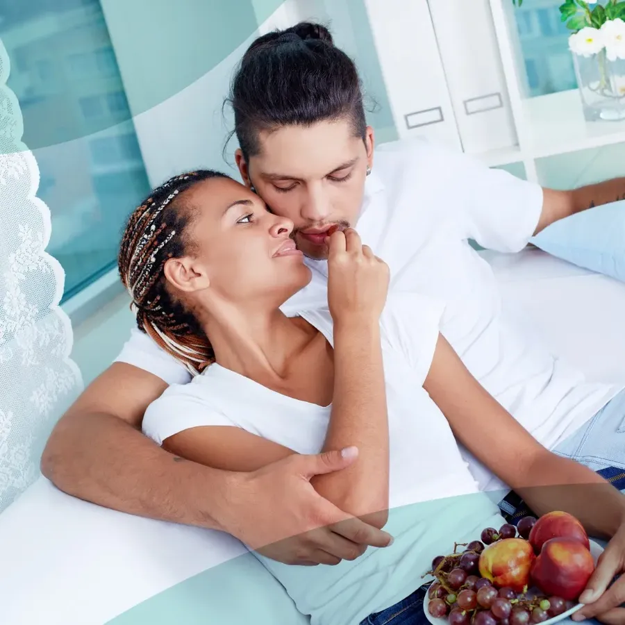 A couple resting privately together at home in Dubai, representing the confidential handling of a comprehensive sexual health checkup from booking to results