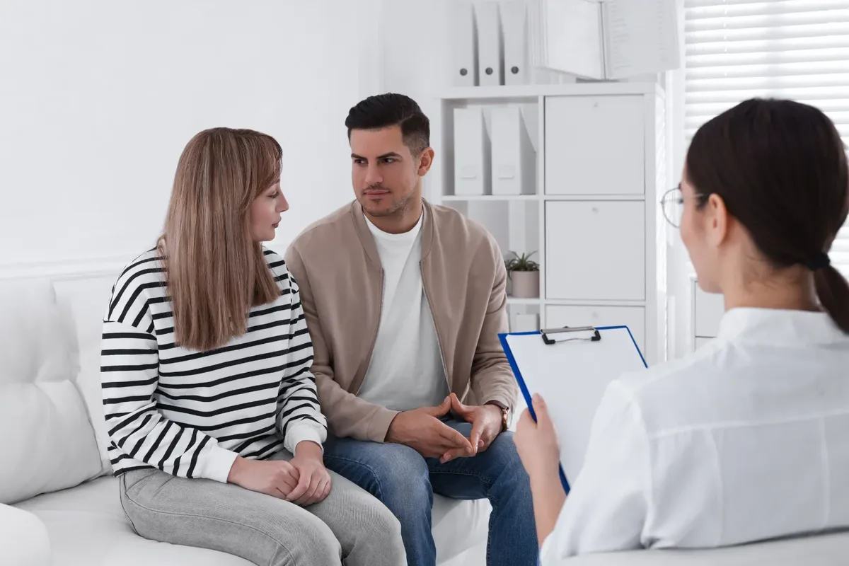 A patient and their partner in a private consultation with a DHA-licensed clinician in Dubai, illustrating the confidential treatment conversation that follows a candida and yeast infection test