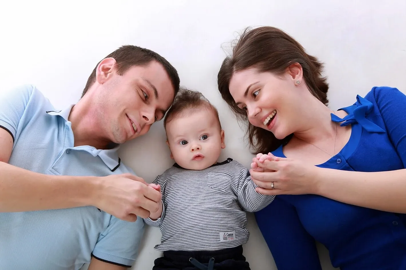 Parents smiling with their baby